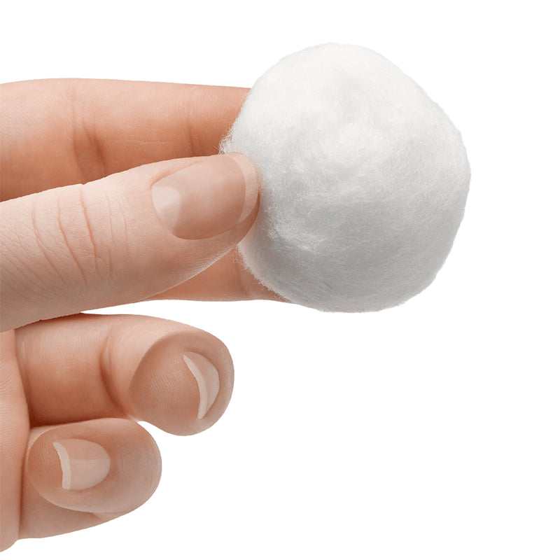 holding cotton ball in hand